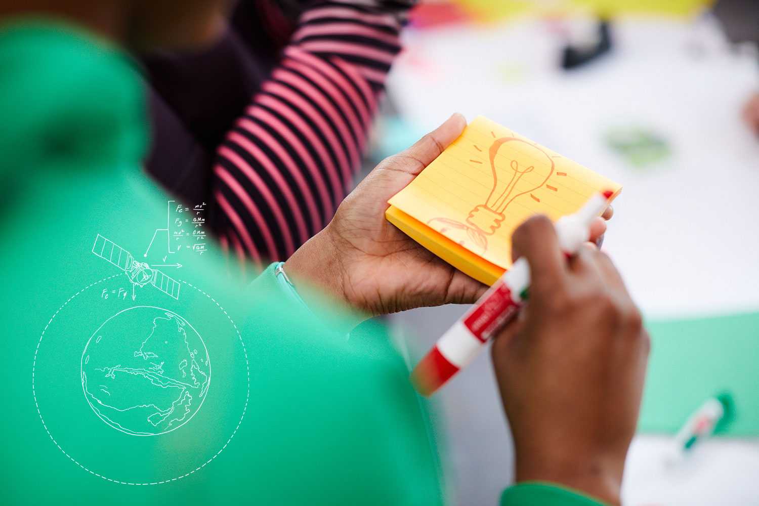 a student writing on a note pad