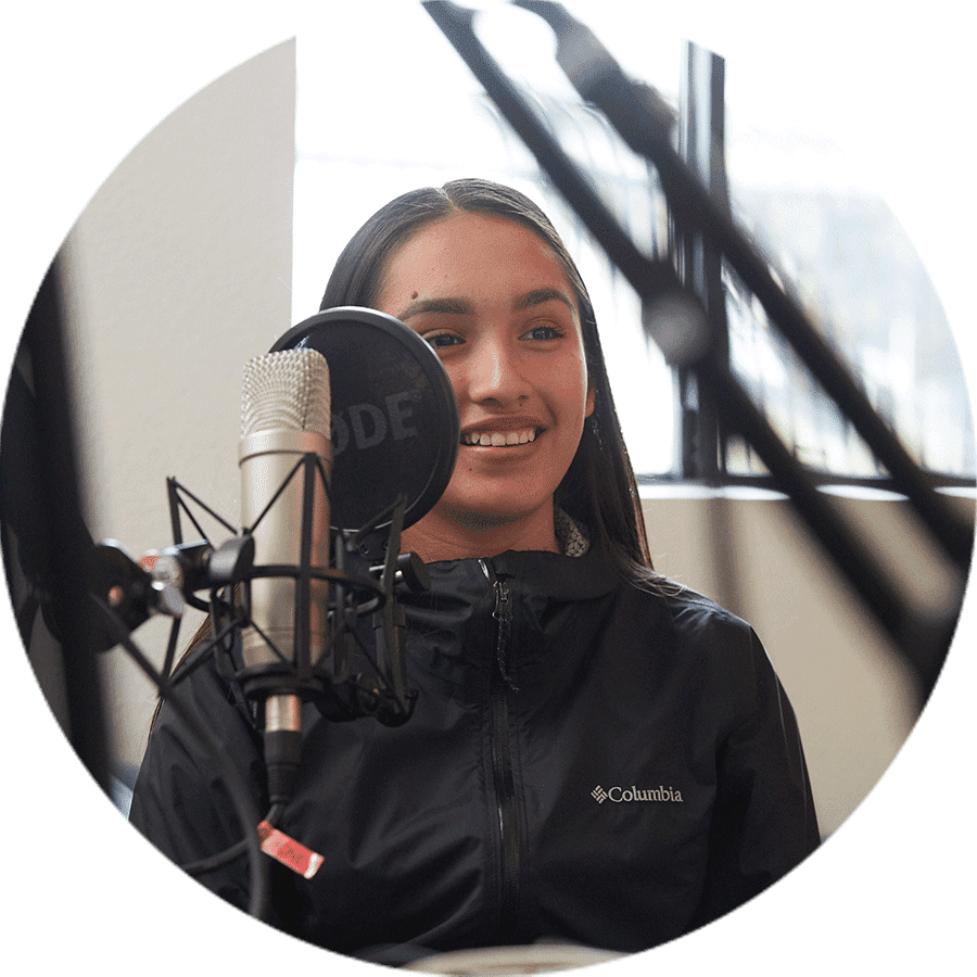 a student speaking into a microphone