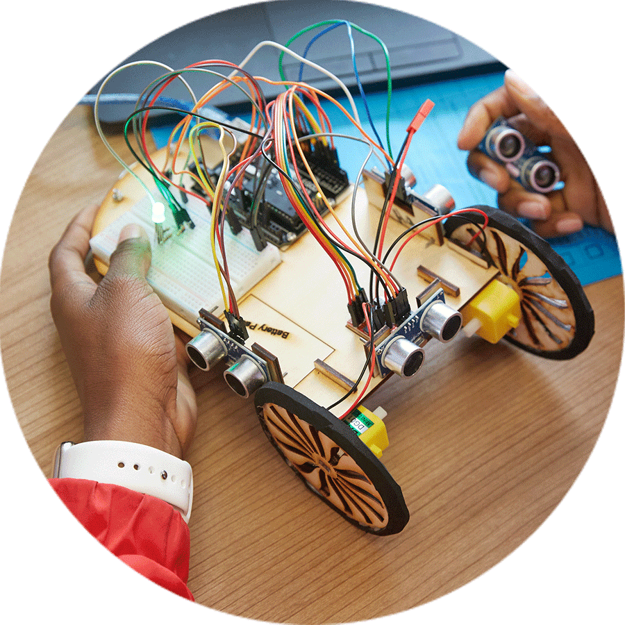 student making a small wheeled robot