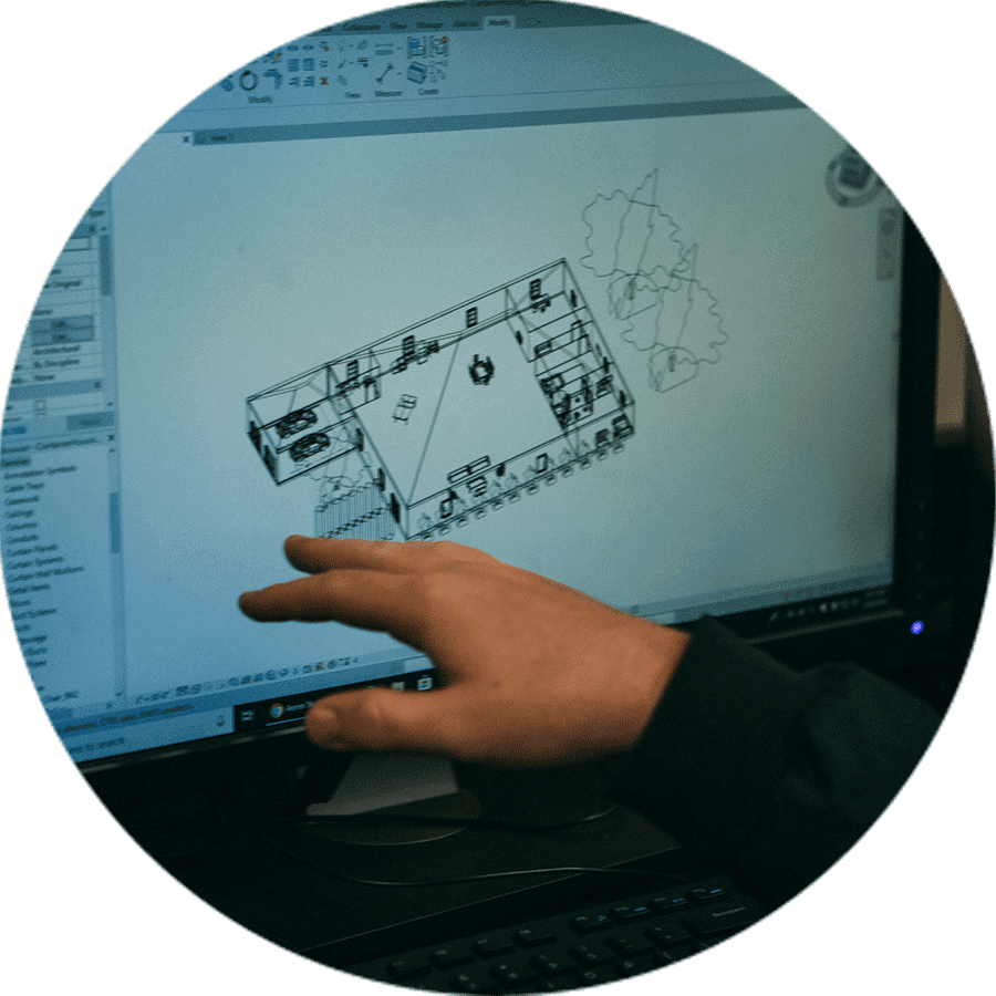 a student completing a floor plan on a computer.