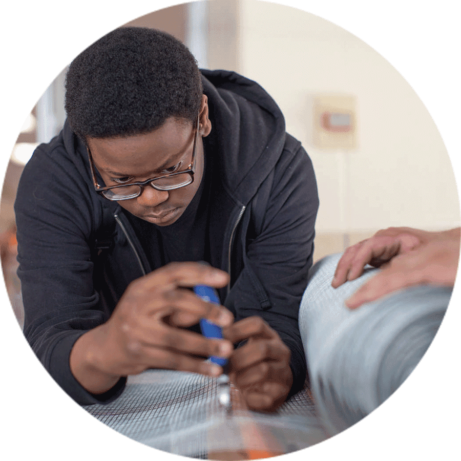 a student cutting material