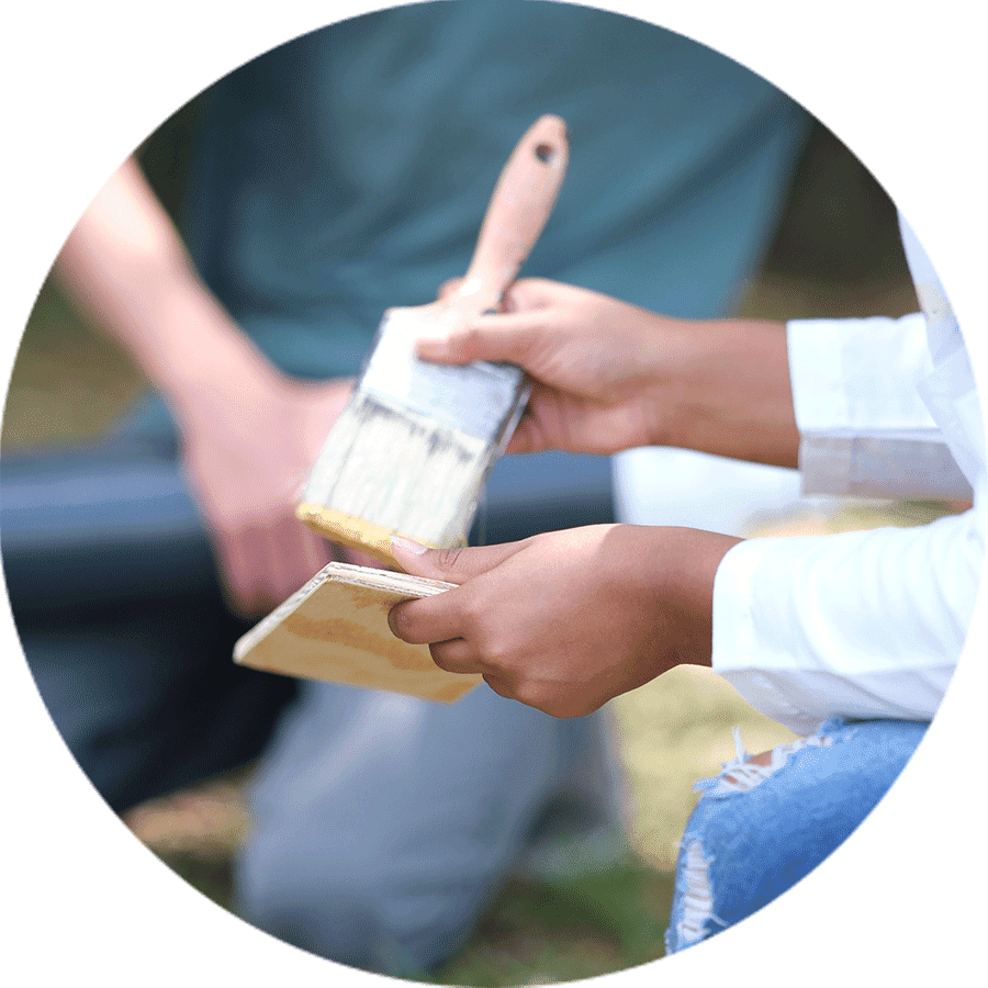 hand holding a paintbrush