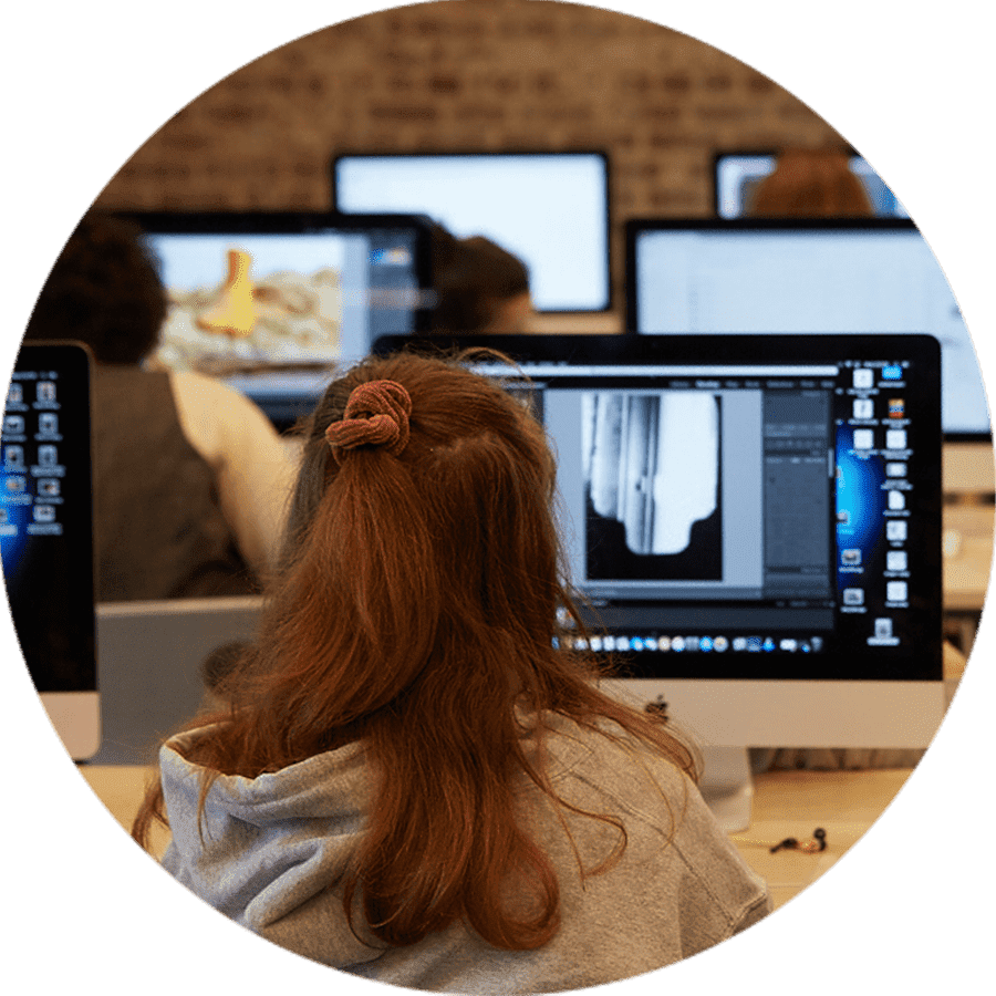 a student working on a desktop computer