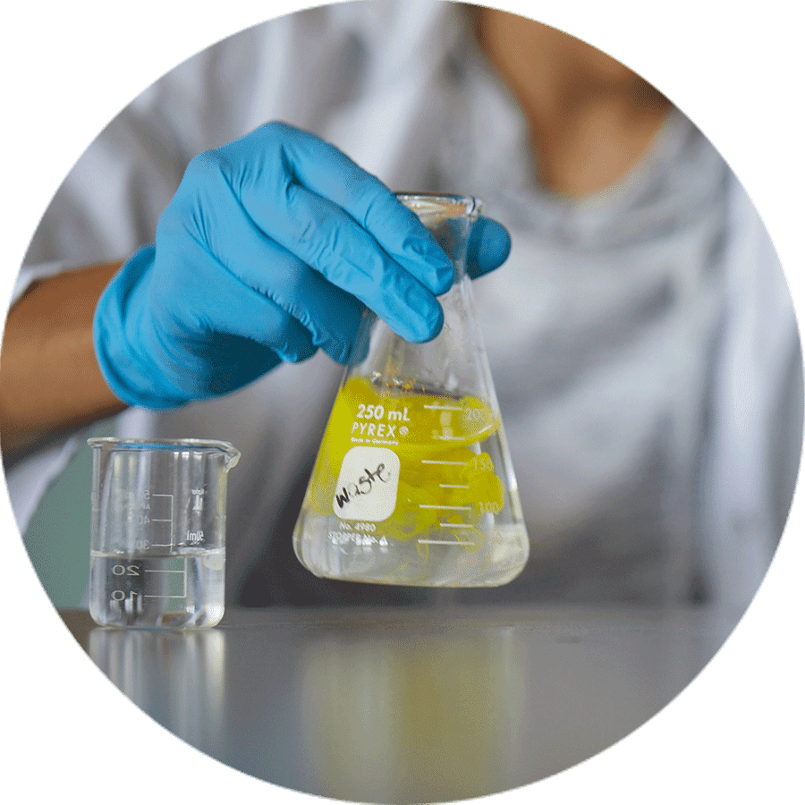 hand holding a science beeker